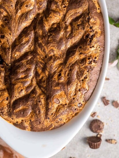 baked brownie peanut butter pudding in an oval baking dish.