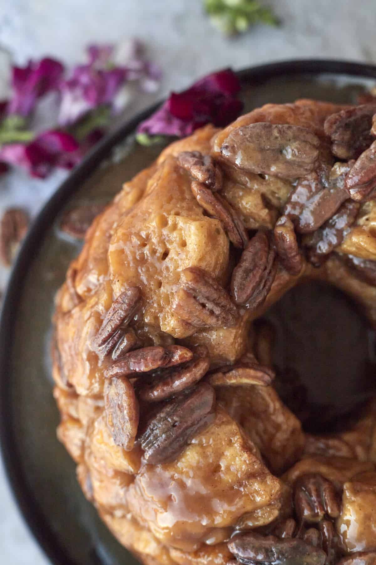 a ring of pecan caramel homemade monkey bread on a plate.