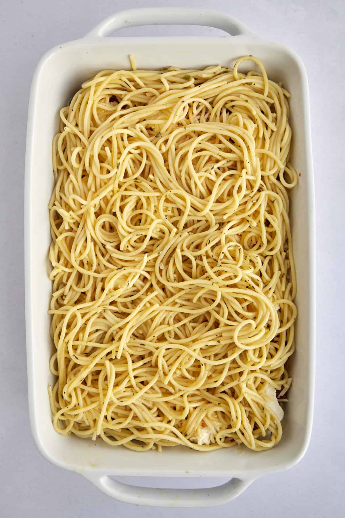 spaghetti noodles in a casserole dish