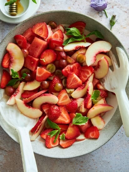A bowl of peach watermelon salad.