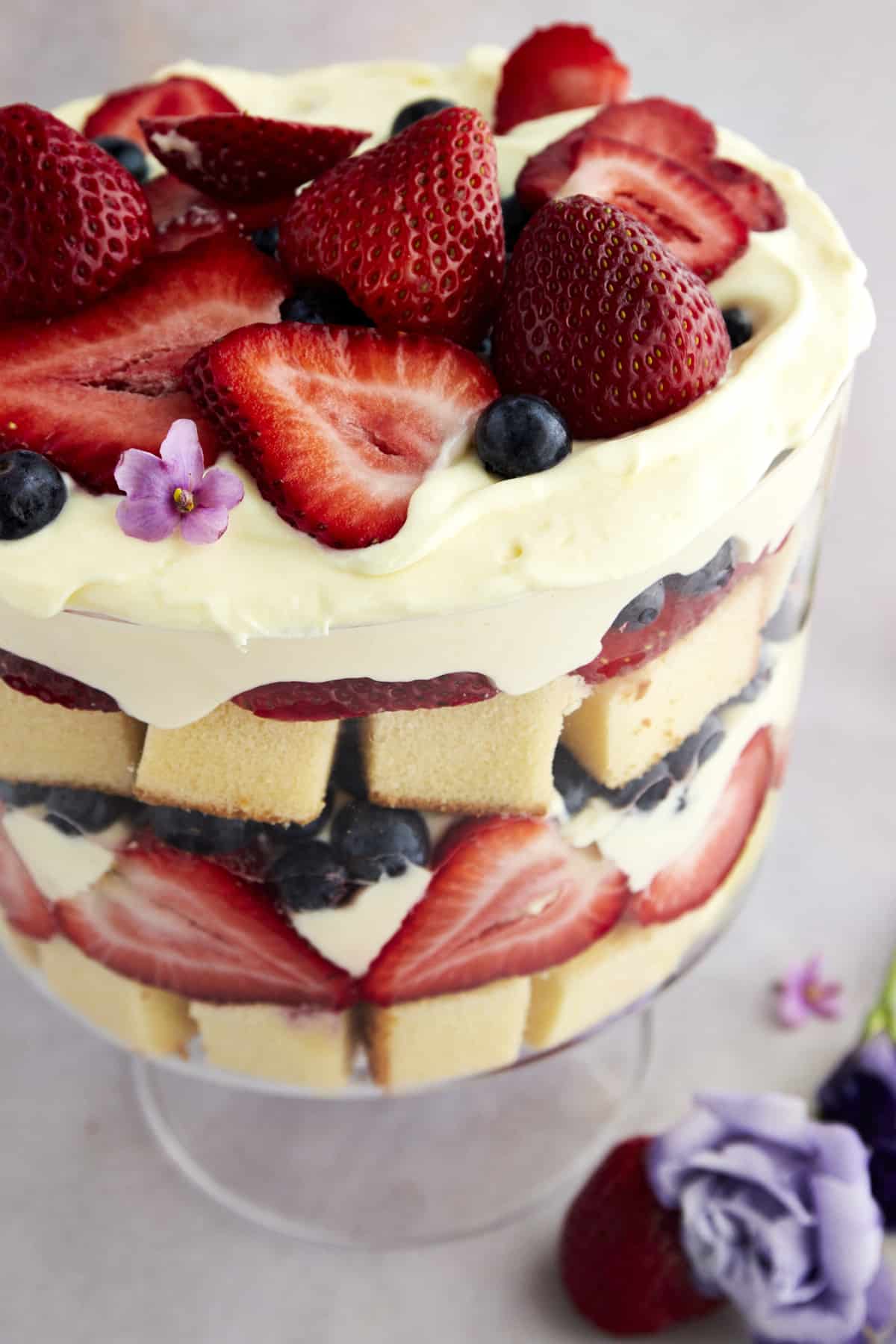 Close up image of a summer berry trifle with strawberries and blueberries. 