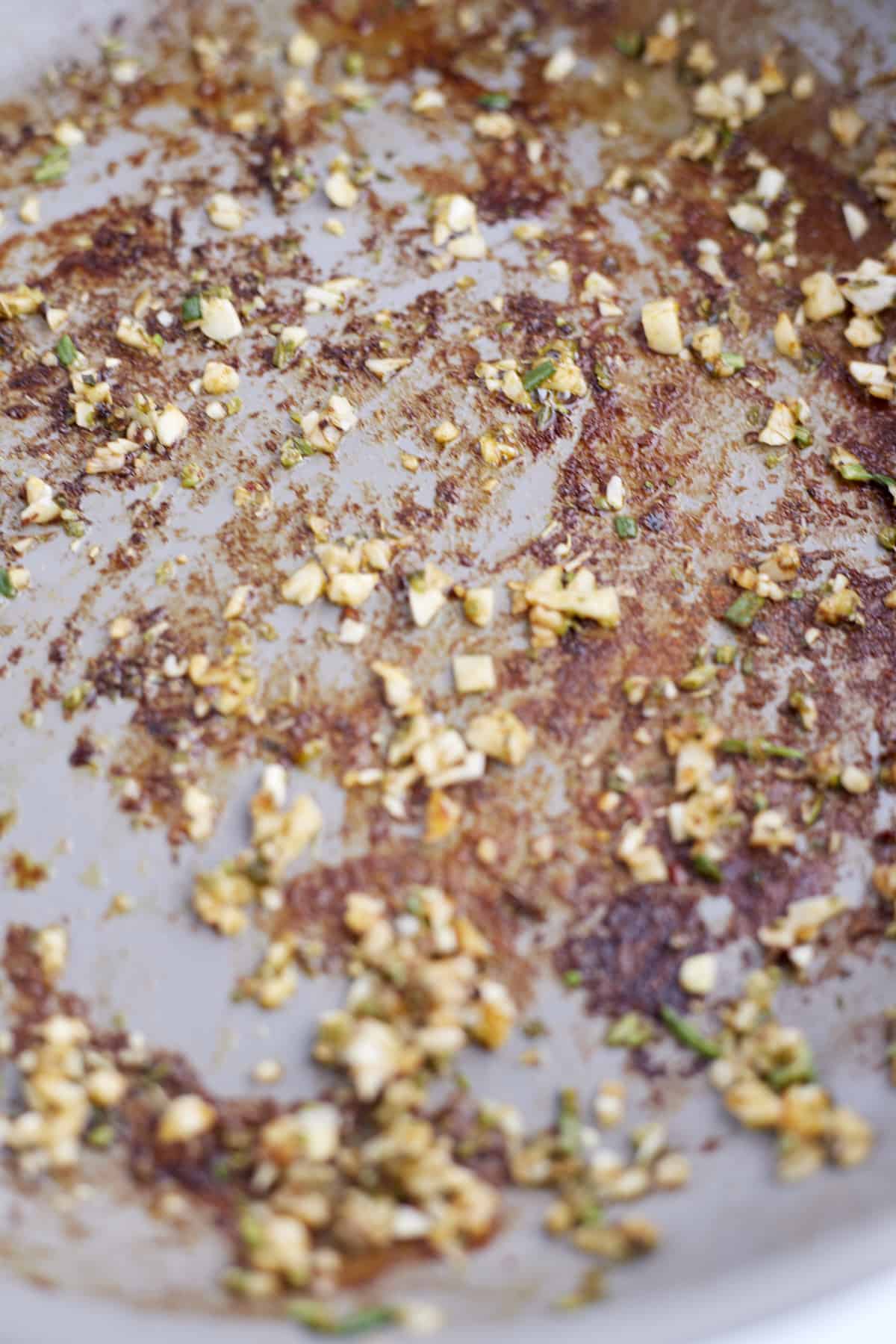 close up of seasonings in a pan to form a creamy sauce.