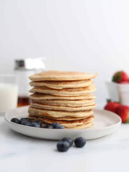 A stack of cottage cheese protein pancakes on a plate.