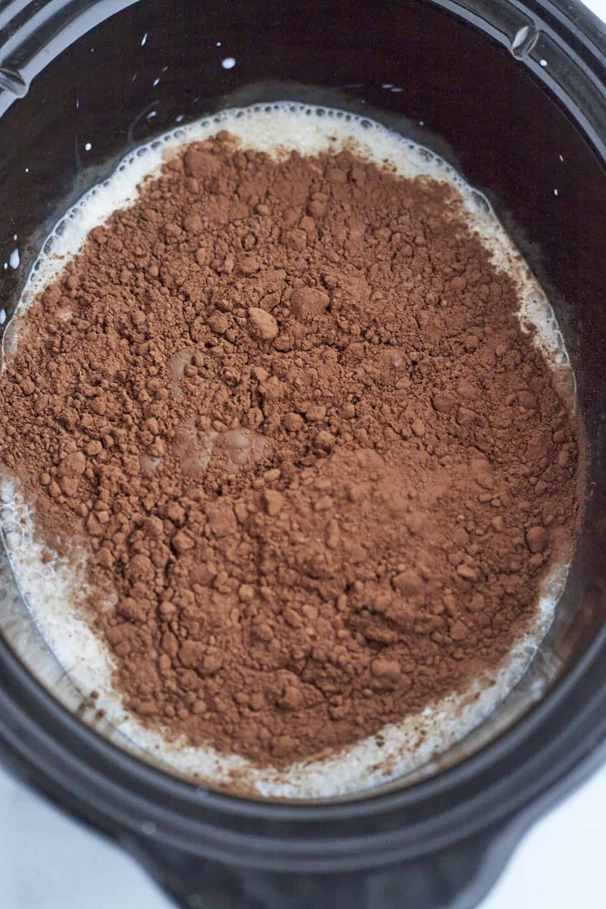 milk, heavy creamy, cocoa powder, and sugar in a slow cooker to make hot chocolate