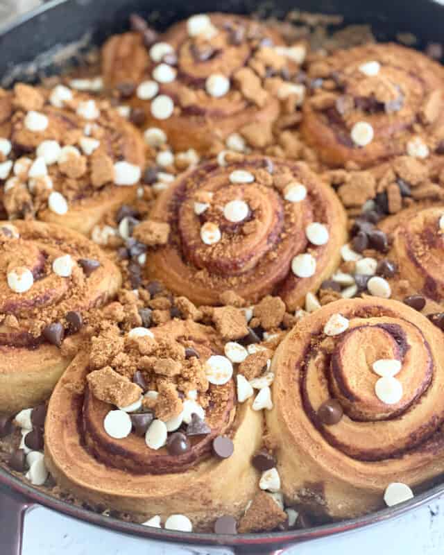 Biscoff cinnamon rolls topped with white and dark chocolate chips