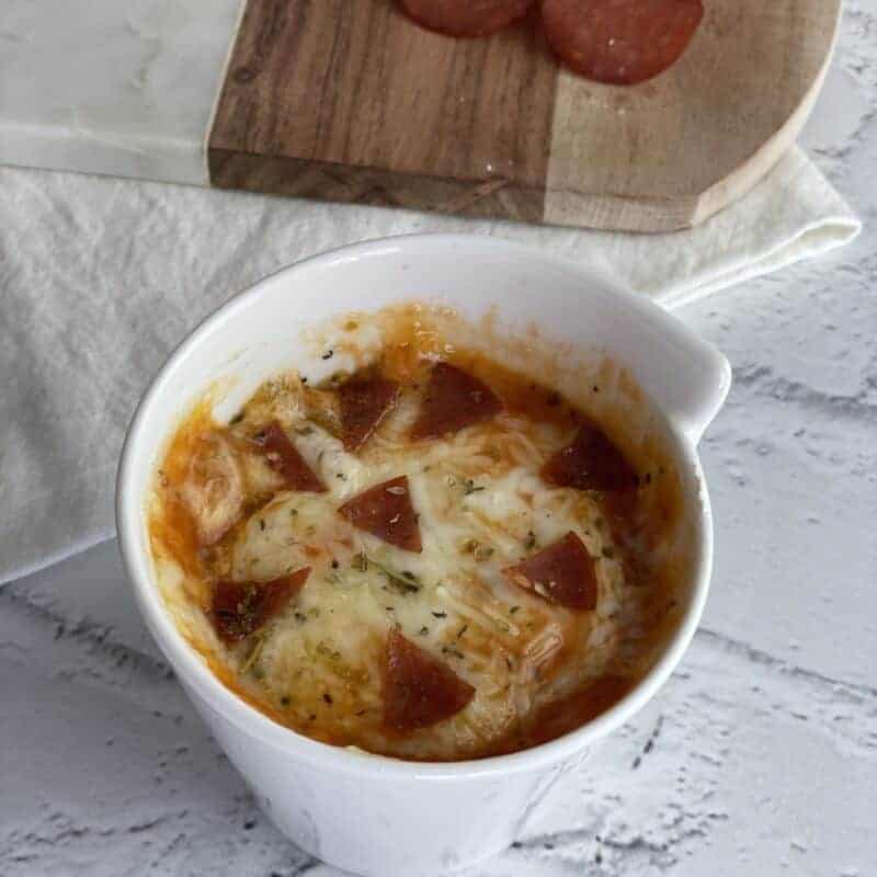 Pepperoni pizza in a mug.