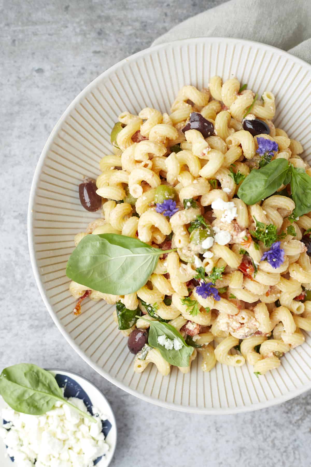 a bowl of tomato and feta pasta