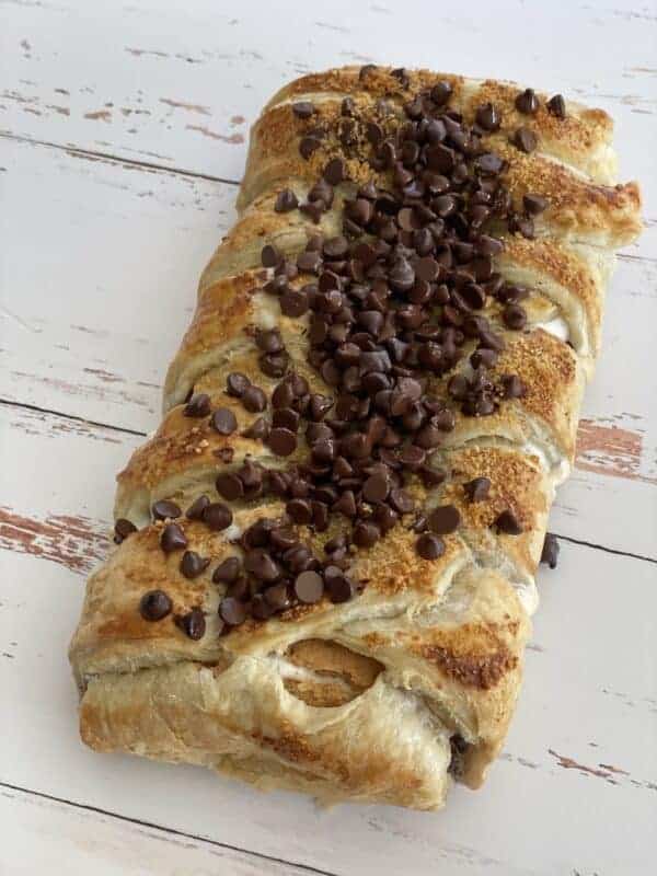 A s'mores braided pastry topped with mini chocolate chips and graham cracker crumbs.