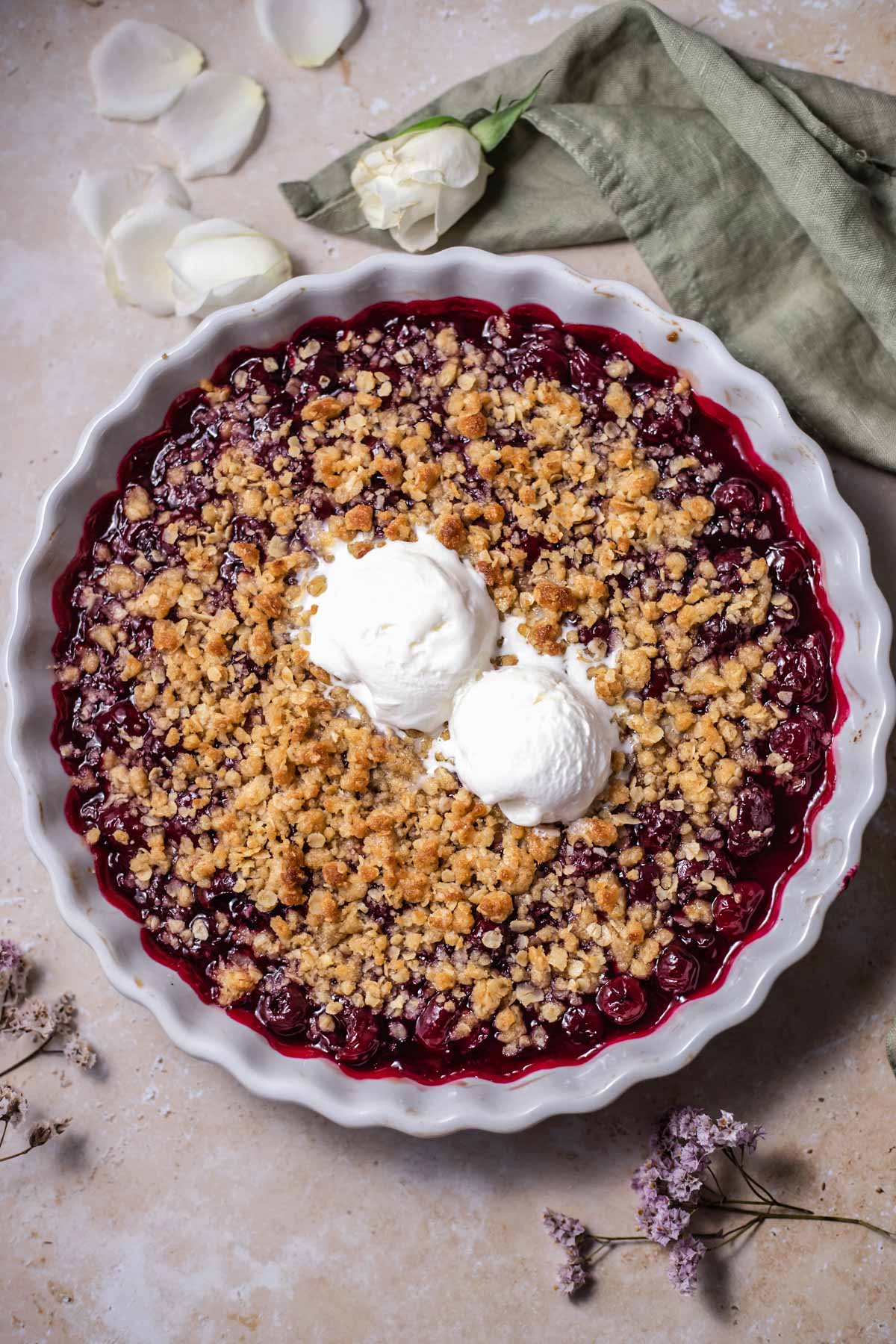 cherry crisp topped with vanilla ice cream