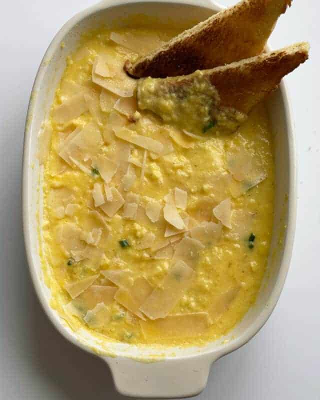 Overhead image of a dish full of baked scrambled eggs. 