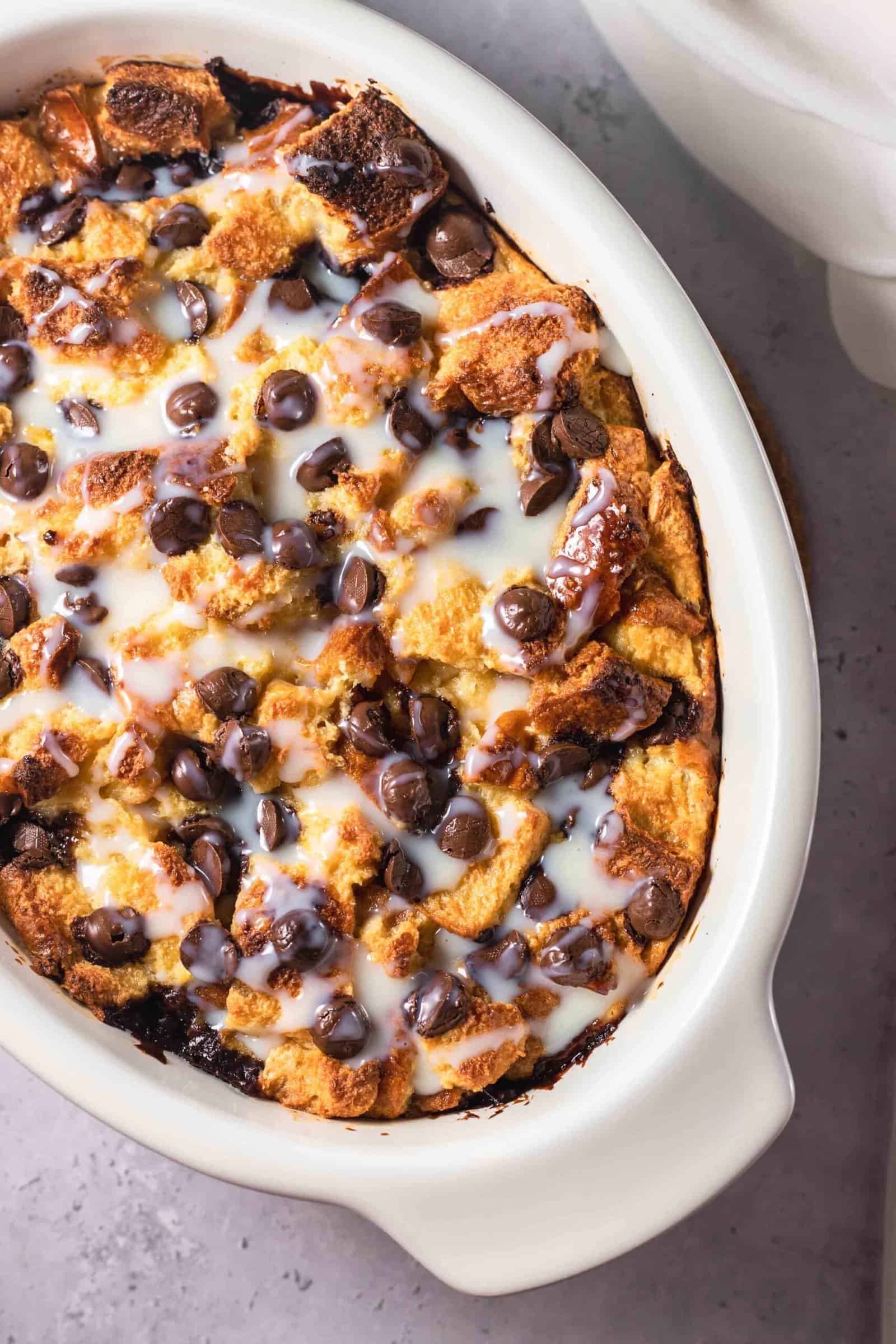 an oval baking dish full of tres leches bread pudding