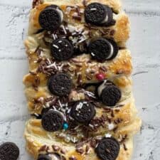 cookies and cream pastry braid topped with Oreos