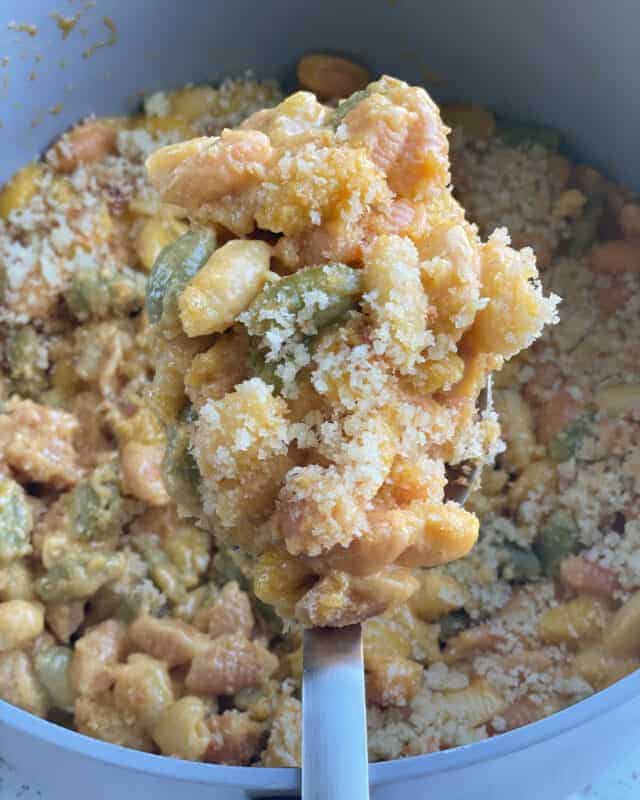 A spoonful of one pot three cheese pasta with a breadcrumb topping.