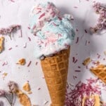 an ice cream cone stuffed with homemade cotton candy ice cream