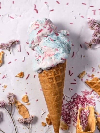 an ice cream cone stuffed with homemade cotton candy ice cream