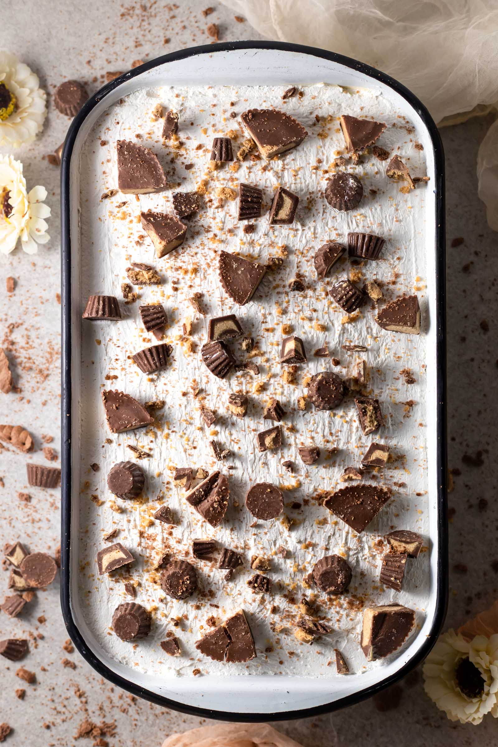 no-bake icebox cake topped with peanut butter cups
