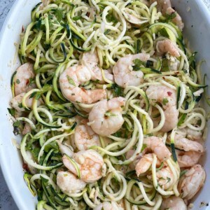 healthy shrimp scampi with zucchini noodles in a baking dish