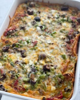 overhead image of a baked breakfast casserole with bread
