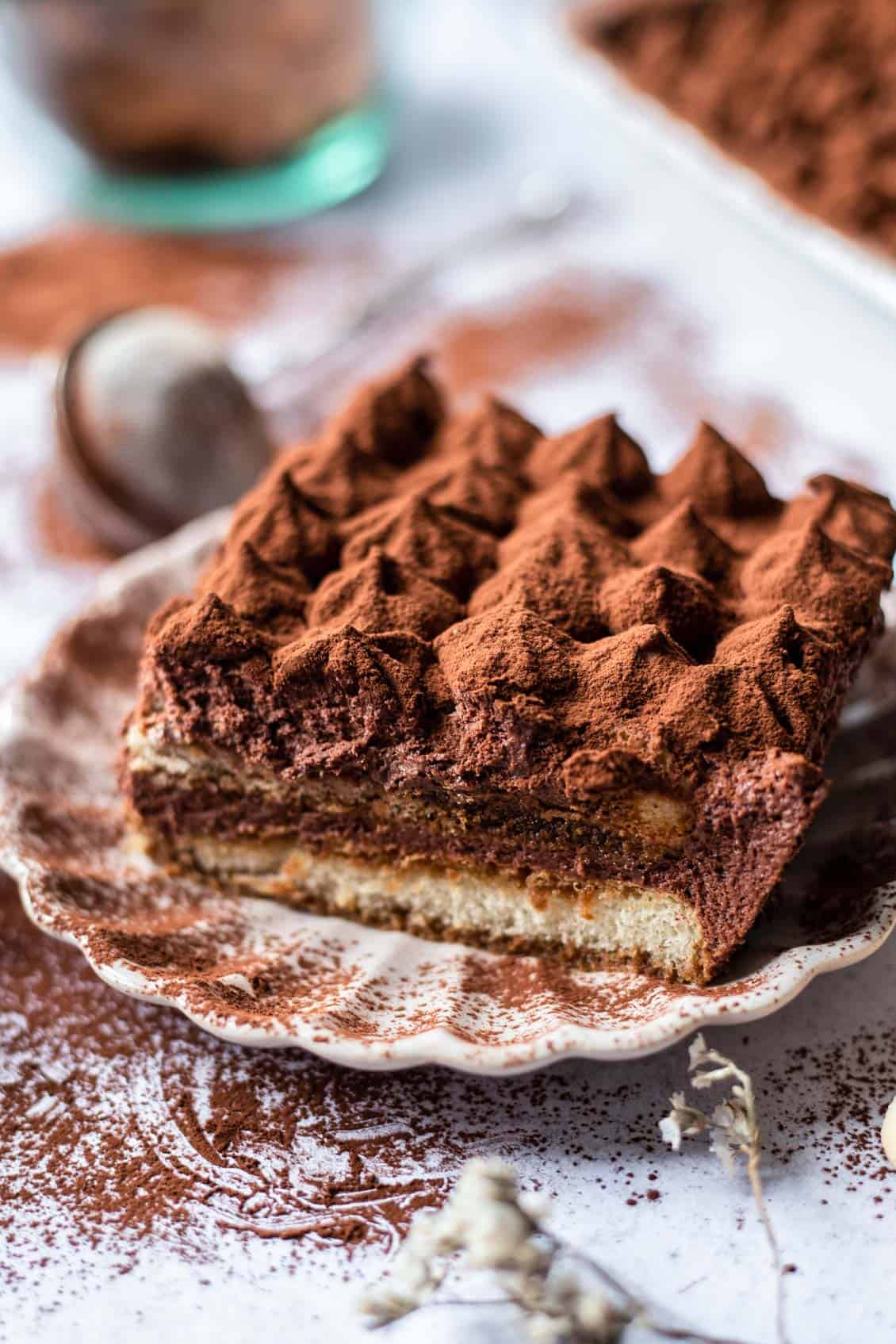 a slice of chocolate tiramisu on a plate.