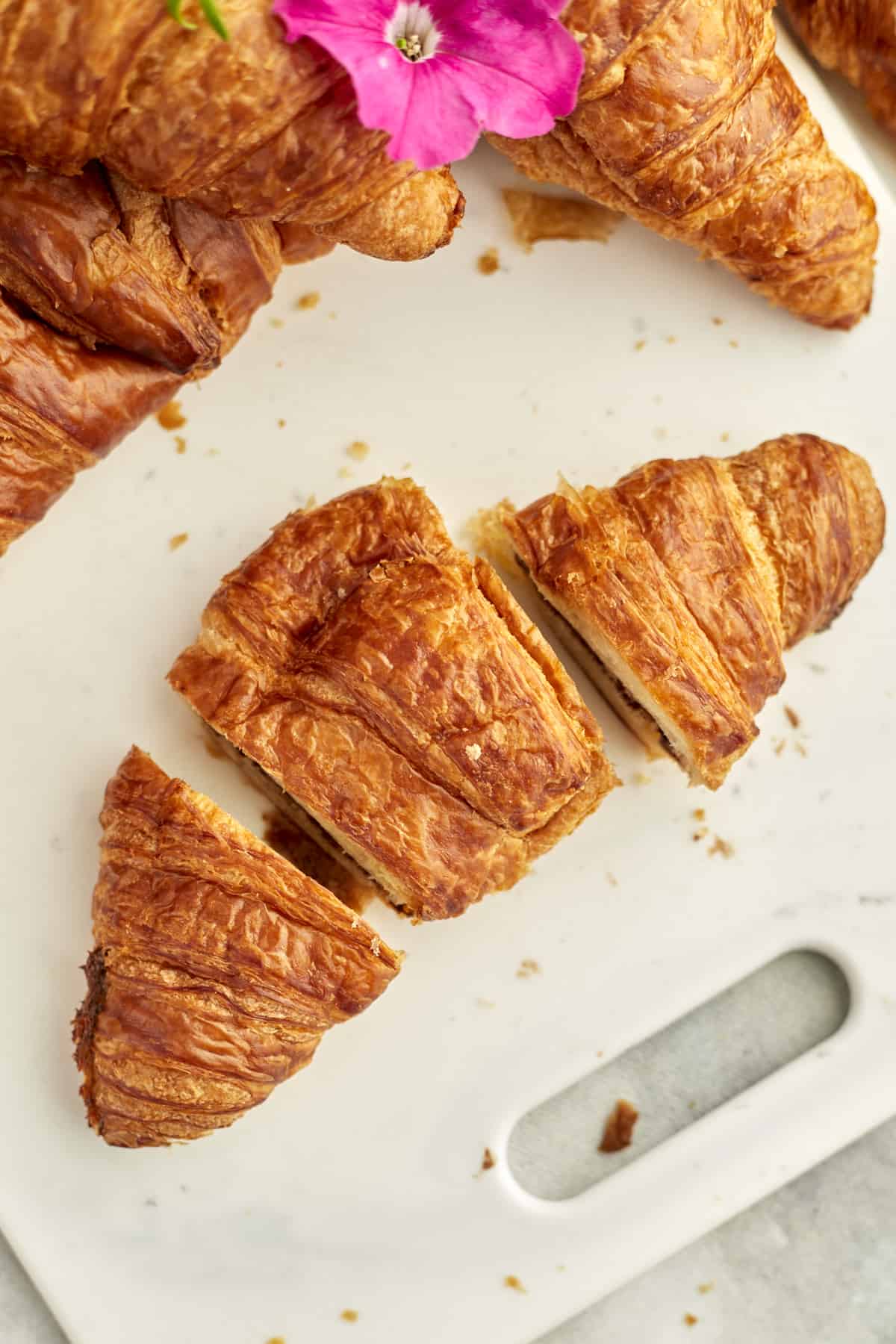 a jumbo croissant that has been cut into three pieces