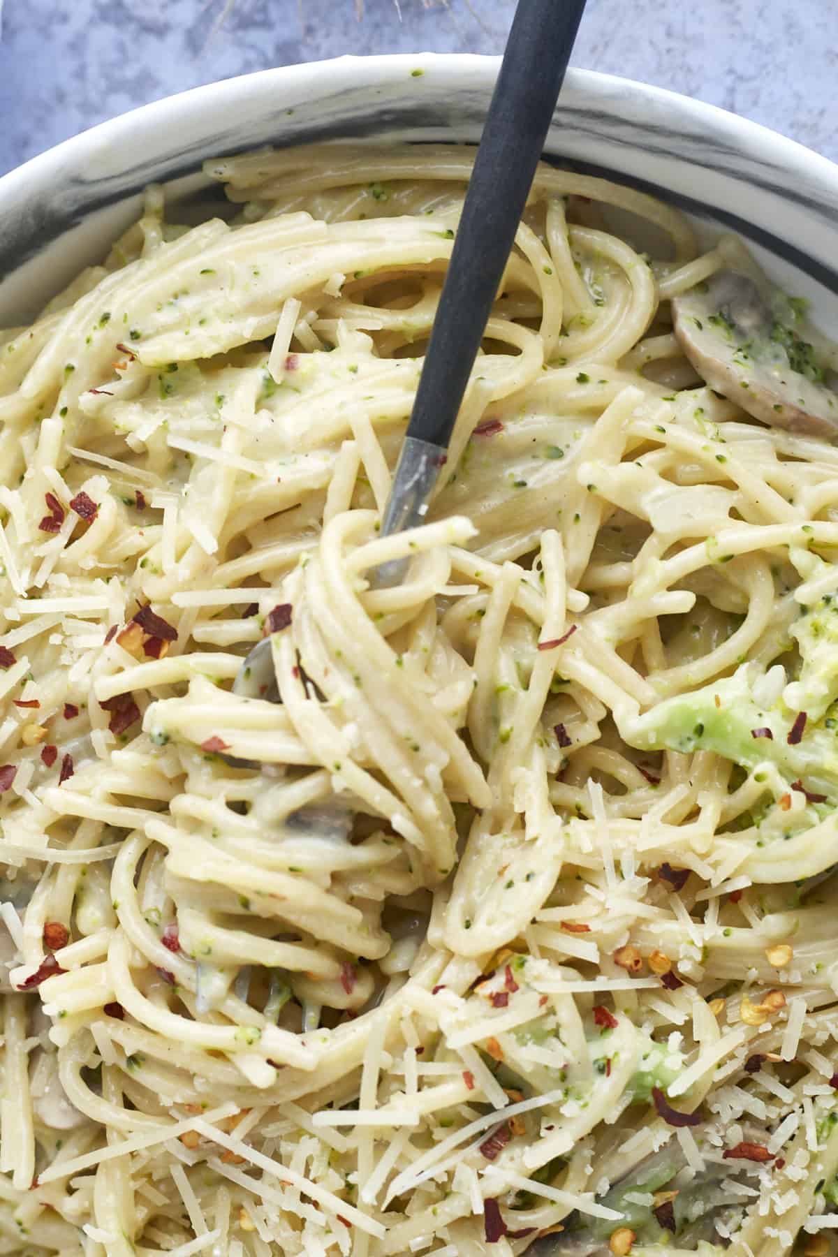 a fork spinning around a bit of one pot pasta primavera