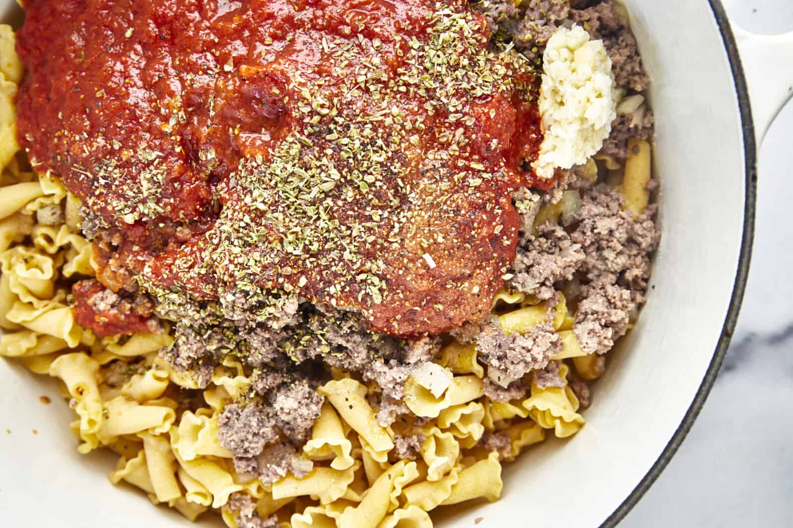 Lasagnette noodles, cooked ground beef, marinara sauce, and seasonings.
