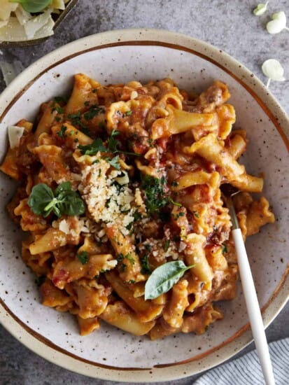 A bowl of one pot lasagna pasta topped with Parmesan cheese.