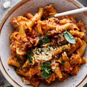 A bowl of one pot lasagna pasta topped with Parmesan cheese.