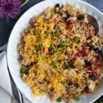 a bowl of easy Mexican rice with cheese and veggies