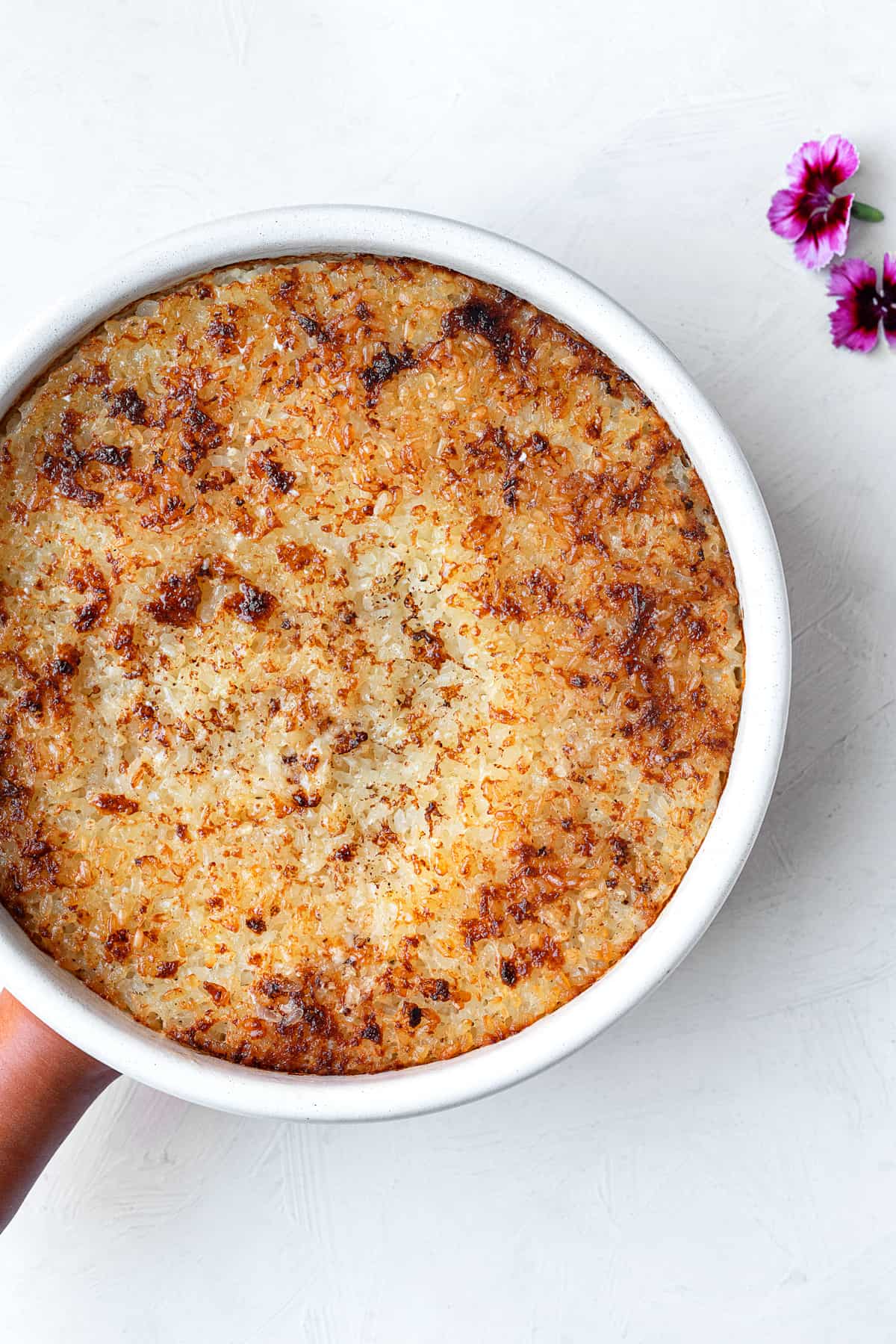 overhead image of a circular dish of Egyptian baked rice