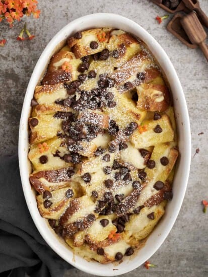 an oval baking dish full of cannoli baked french toast