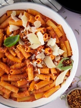 overhead image of a bowl of pasta topped with grated Parmesan.