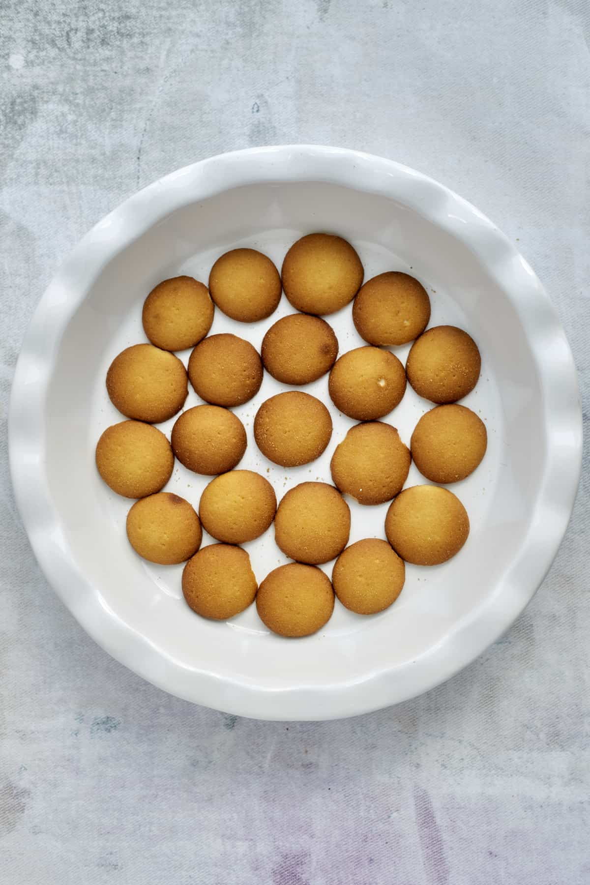 Nilla wafers in the bottom of a baking dish