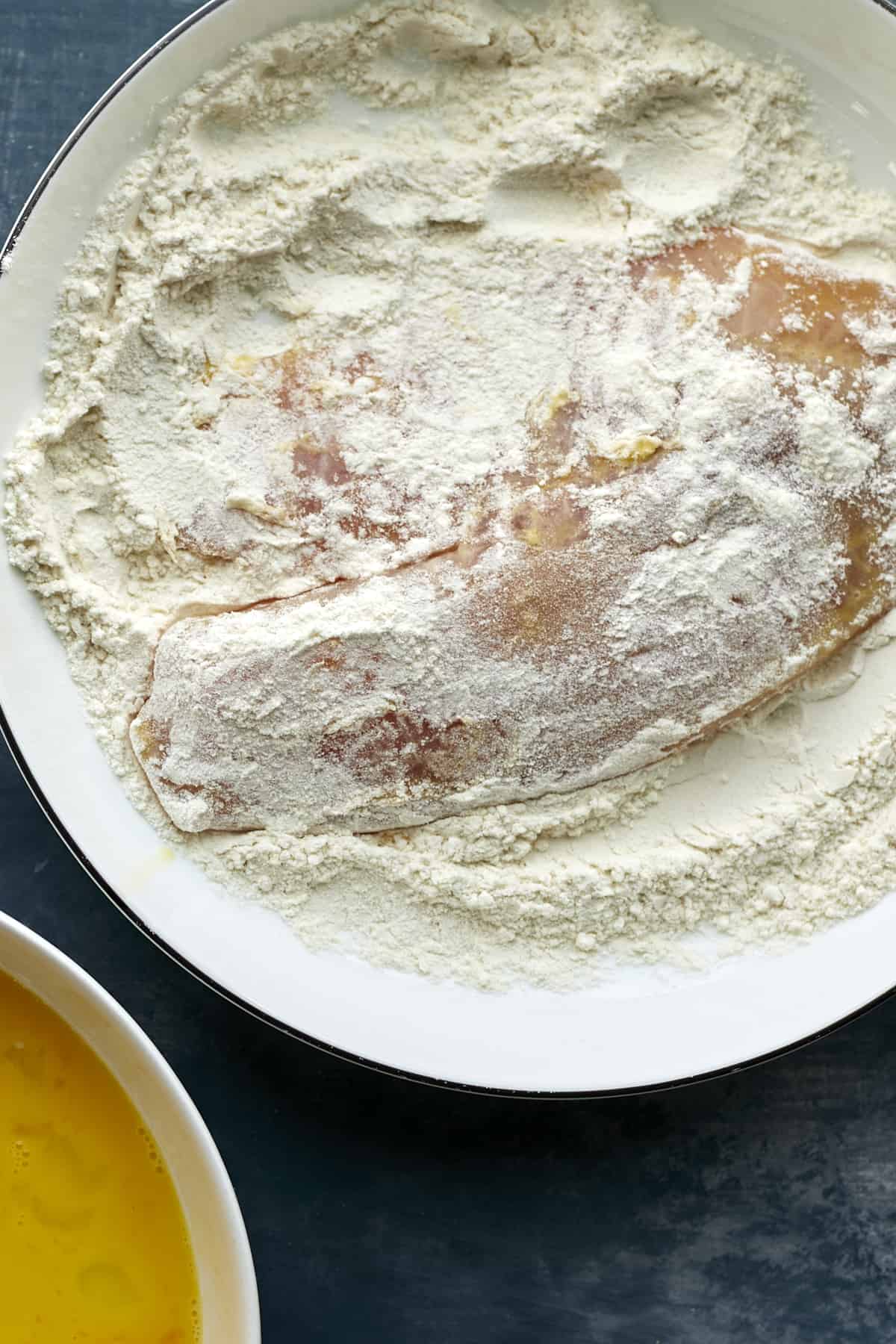 tilapia being dredged in flour