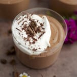 single serving chocolate mousse with whipped cream and chocolate shavings