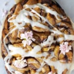 overhead image of slow cooker apple cinnamon rolls with icing.