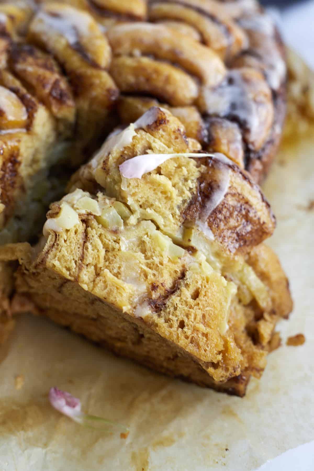 sliced pieces of slow cooker apple cinnamon rolls.