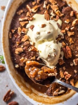 a spoon scooping up a bit of easy pecan pie cobbler