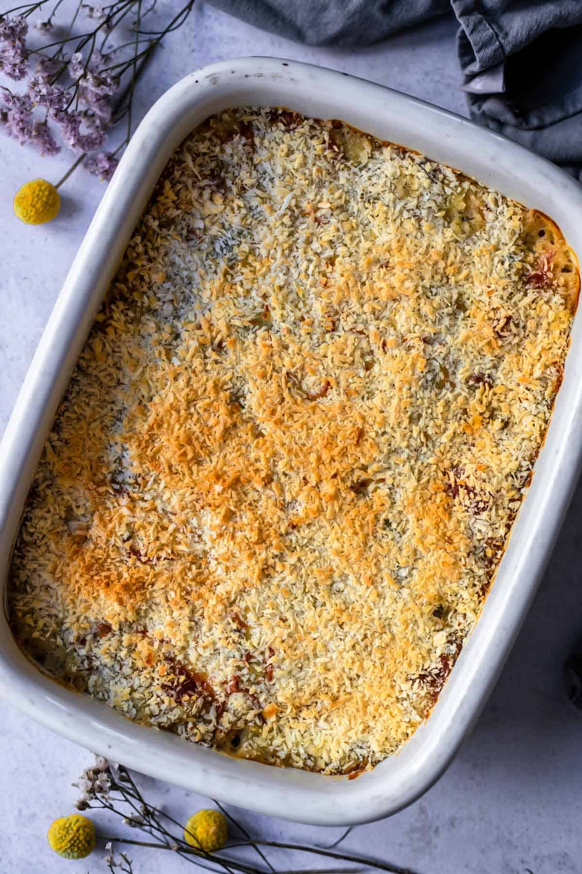 overhead image of a baked casserole in a white dish