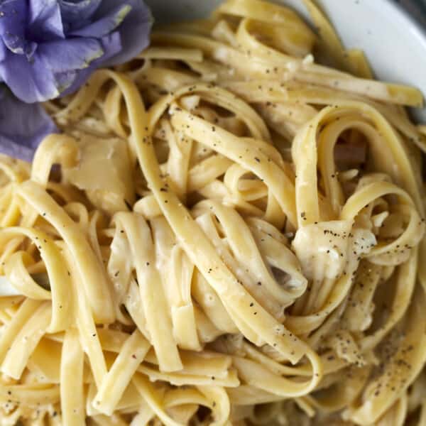 Close up image of one pot fettuccine alfredo in a bowl.