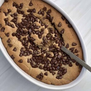 an inside out chocolate chip cookie with a spoon scooping out the center