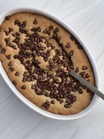 an inside out chocolate chip cookie with a spoon scooping out the center