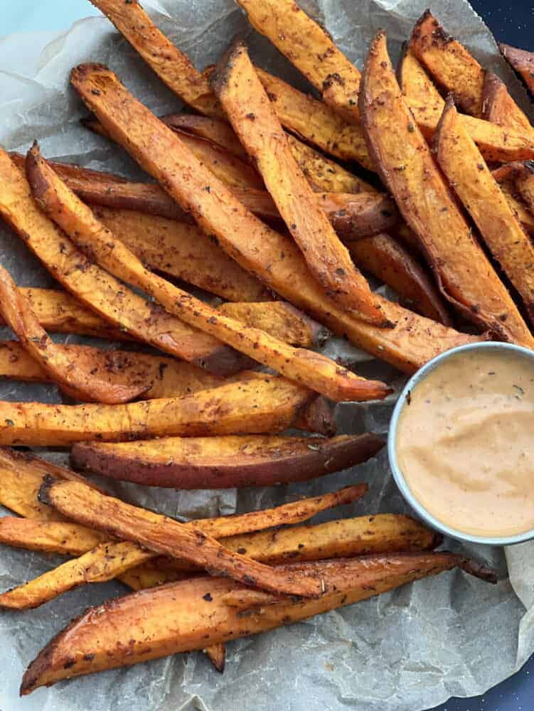 close up image of seasoned baked sweet potato fries.