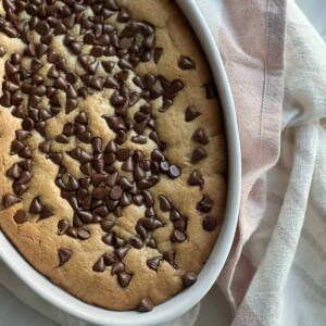 an oval dish with an inside out chocolate chip cookie