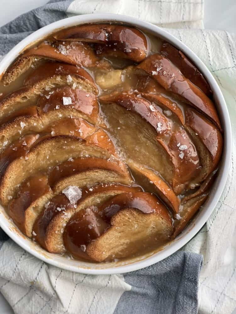 a round dish full of salted caramel bread pudding