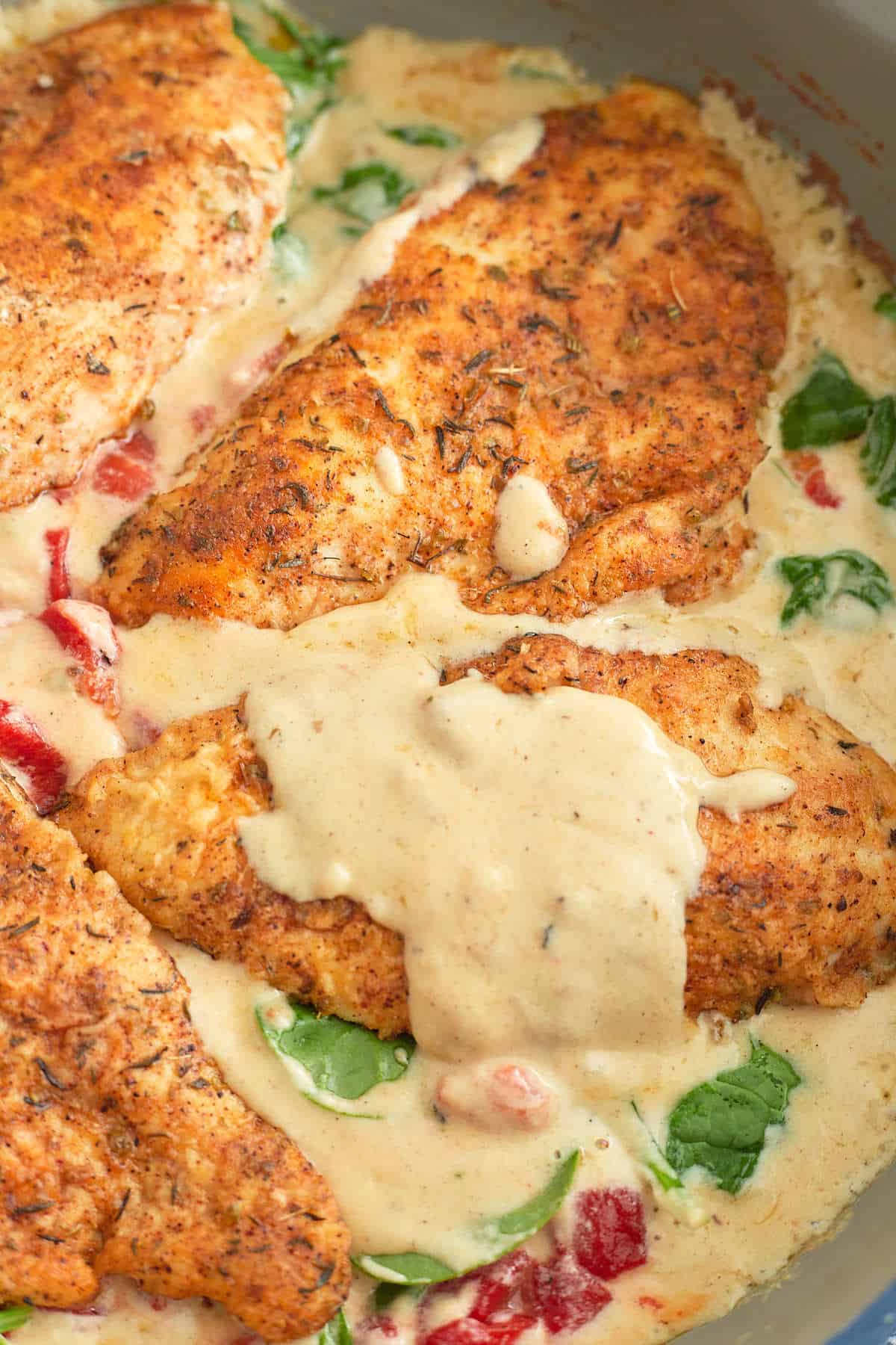 Close up image of Marry Me Chicken in a skillet. 