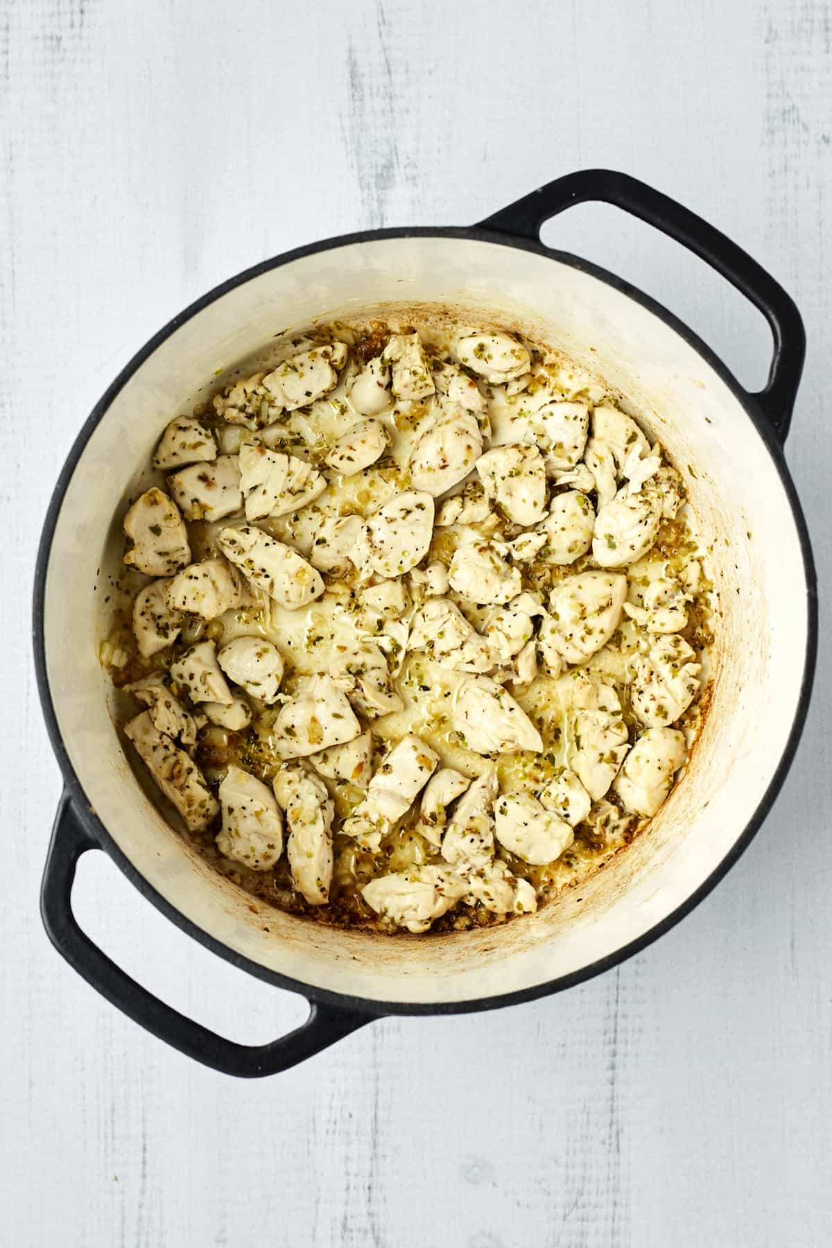 Cooked, seasoned chicken in a large pot.