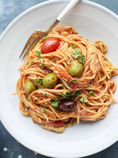 a serving of one pot Greek spaghetti on a plate with a fork