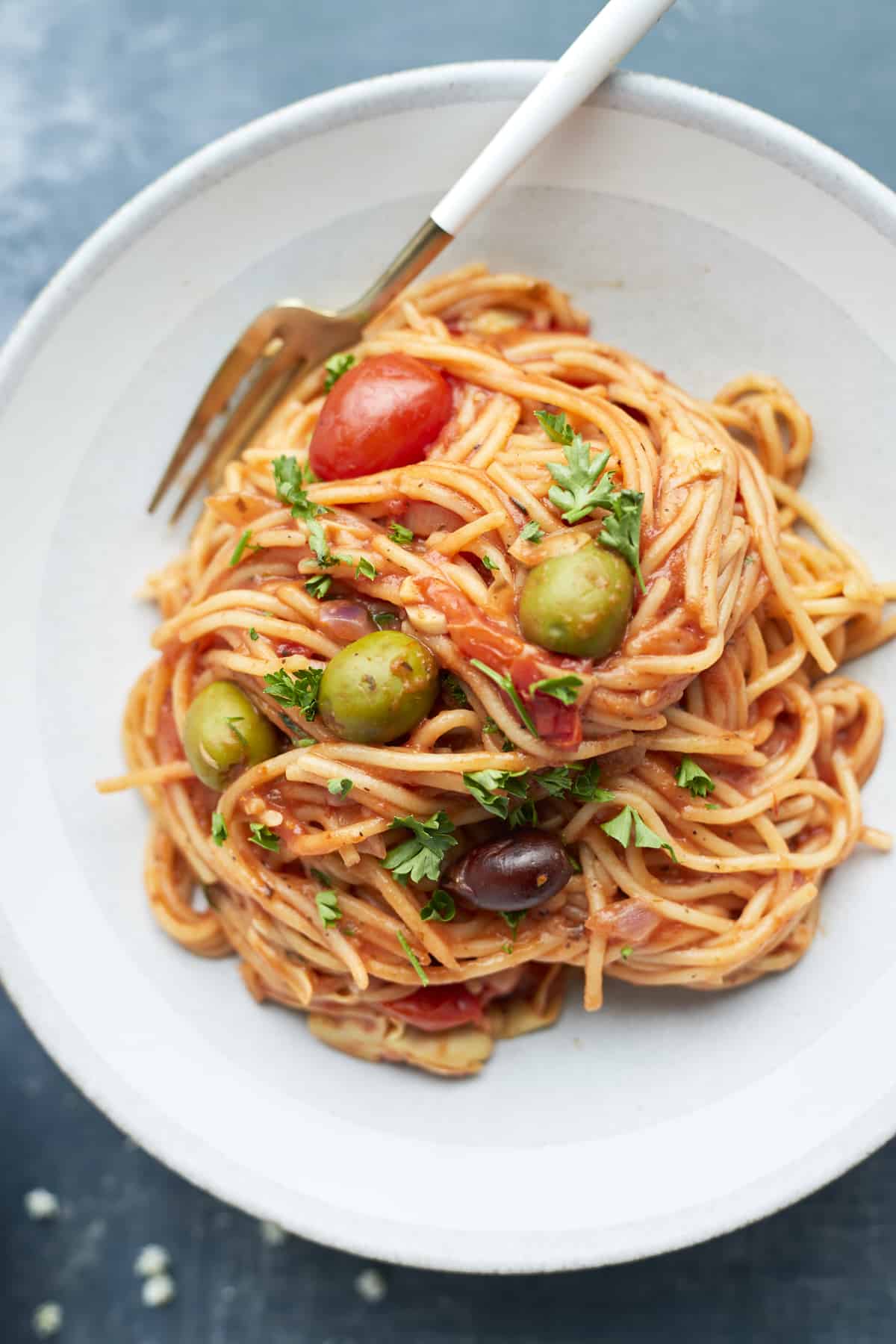 Plated greek spaghetti recipe with a fork on the side 