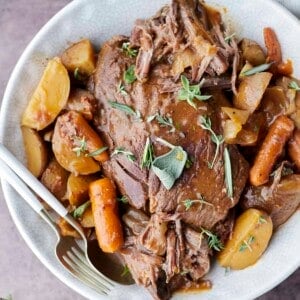 Slow cooker beef pot roast with potatoes and carrots.